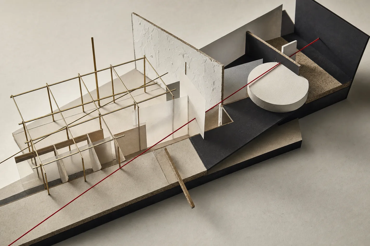 Constructivist study model showing an architectural grid transitioning into spatial zones