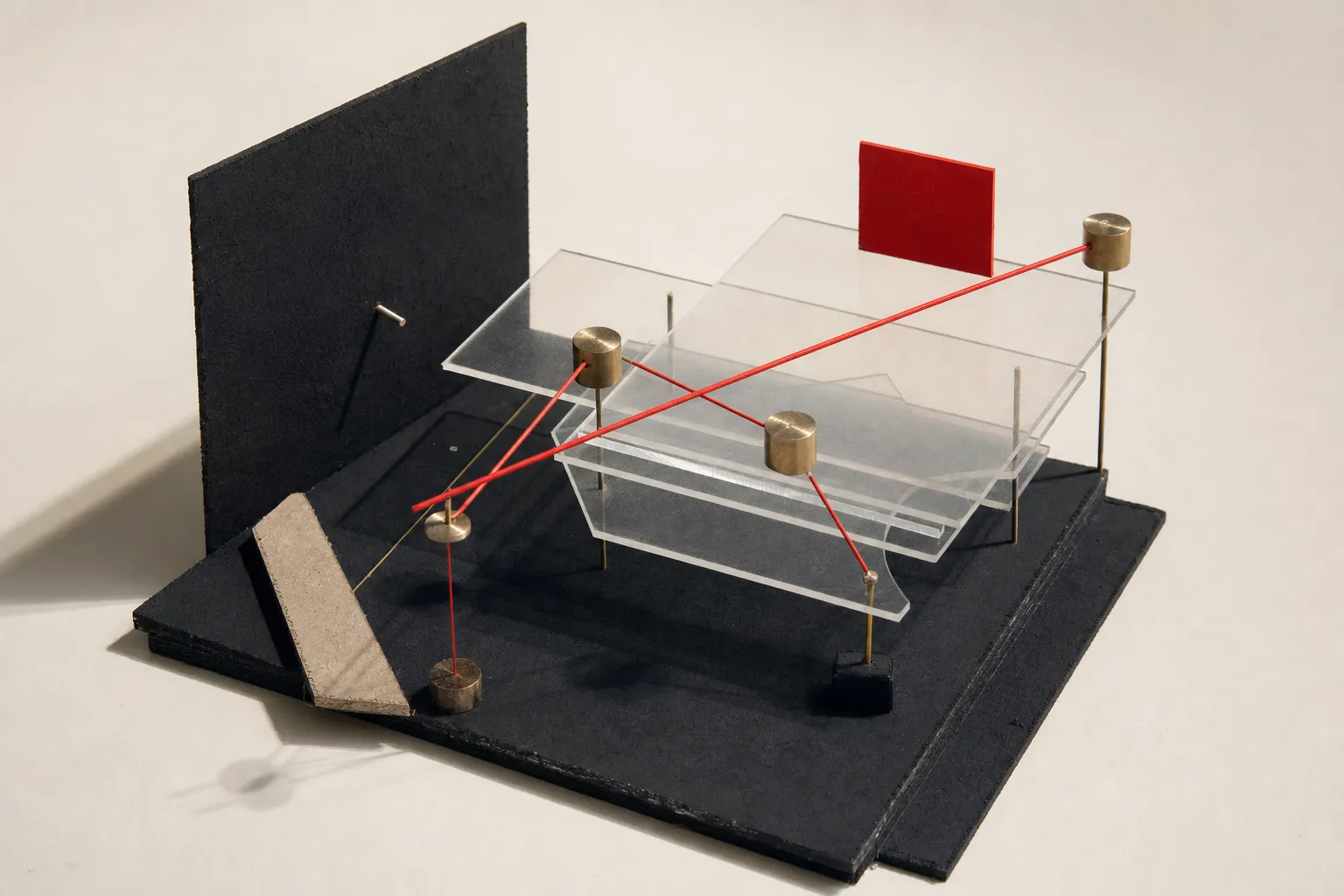 Constructivist study model of stacked translucent acrylic layers and metallic decision nodes with red linear vector accents